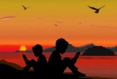 21883537 silhouette bambini che leggono un libro sulla spiaggia tramonto estate1